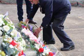 Captain Tom Woodhams from the Warrnambool Fire Brigade lays a wreath.