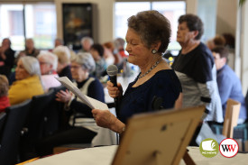 Barbara Cathie spoke about each gown as it was paraded.