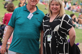 John and Hospice manager Emmalee Bell enjoy the carols.