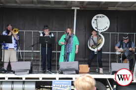 Members of Dixie Nouveau entertain crowds at Dennington.