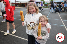 Grace and Ayden Ghiggioli were keen to tuck into some potato on sticks during their visit to Dennington last weekend.