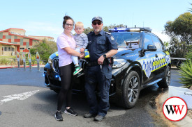 Emily McCullagh and young Bentley were keen to take a close look at the police car thanks to Graeme Cox.