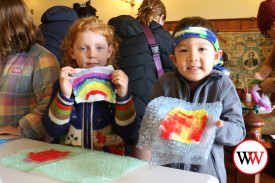 Five year-olds Kathleen Moore and Felix Bannister proudly show their work.