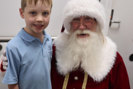 Six year-old Isaac Sinioukov of Warrnambool was happy to see Santa and Miss Holly while visiting his new baby sister Evie in the maternity ward.