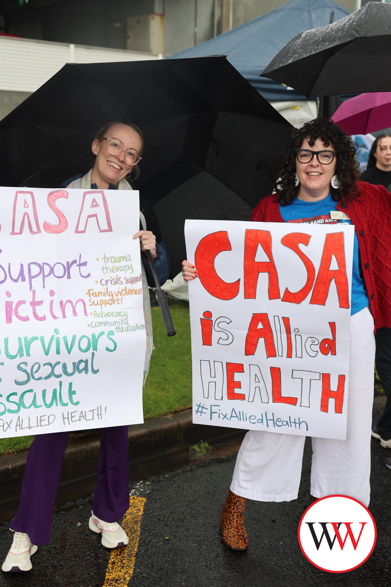 Sexual assault councillors Tara Thomas and Liz Clarke braved the wet weather to have their messages heard