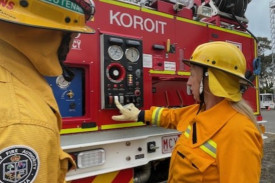 Alistair Cozens assists new member Linda Dickson with skills training.