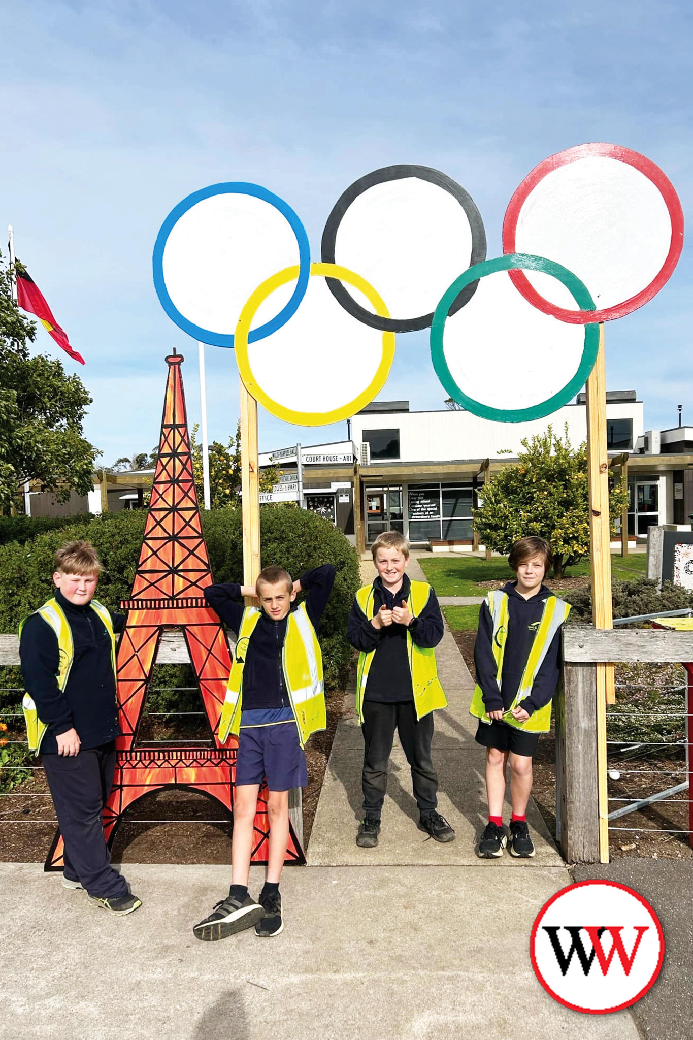 Carey, Beckett, Harvey and Levi at the front of the school.