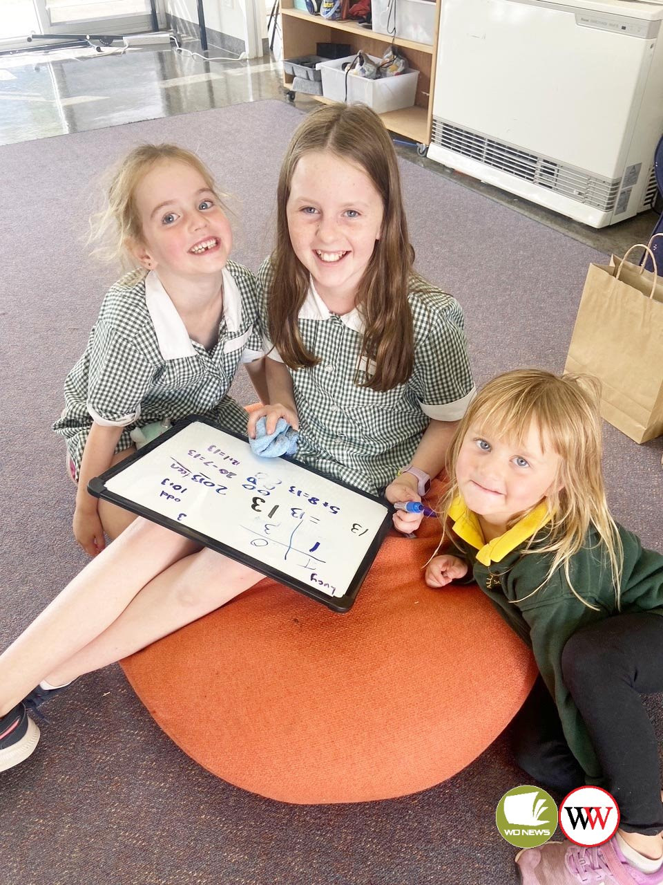 Charli, Lucy and Isla work together.