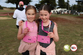 Ten year-olds Isla Seebeck and Liv Thomson were thrilled to receive a medal after completing the three-kilometre event.