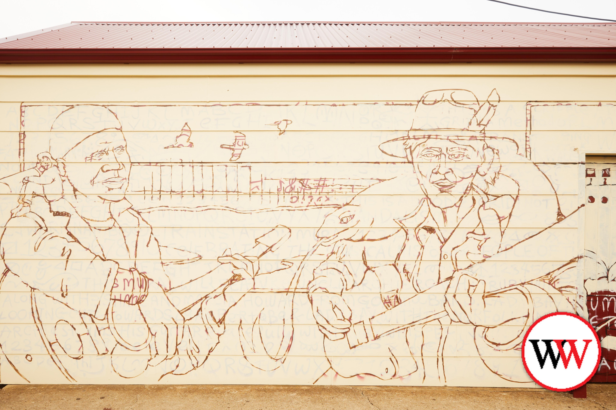 The mural begins to take shape.