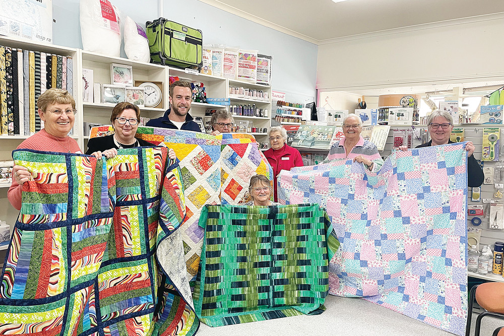 Initiative appreciated: Participants in Social Quilting for Good donated three quilts to Mackilliop Family Services to be given to foster children.