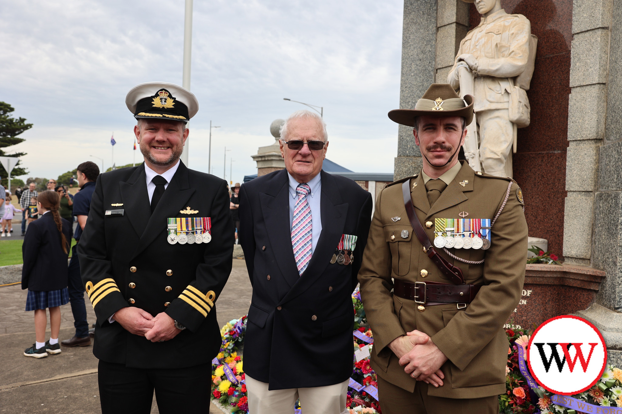 Crowds gathered at various locations across the district last Friday to pay their respects on Anzac Day. Included among guests at the Warrnambool ceremony were, from left, Commander Ronald Trigg from Adelaide, Warrnambool RSL sub-branch president Richard Ridgwell and Major Leigh Brown 8/7 RAR.
