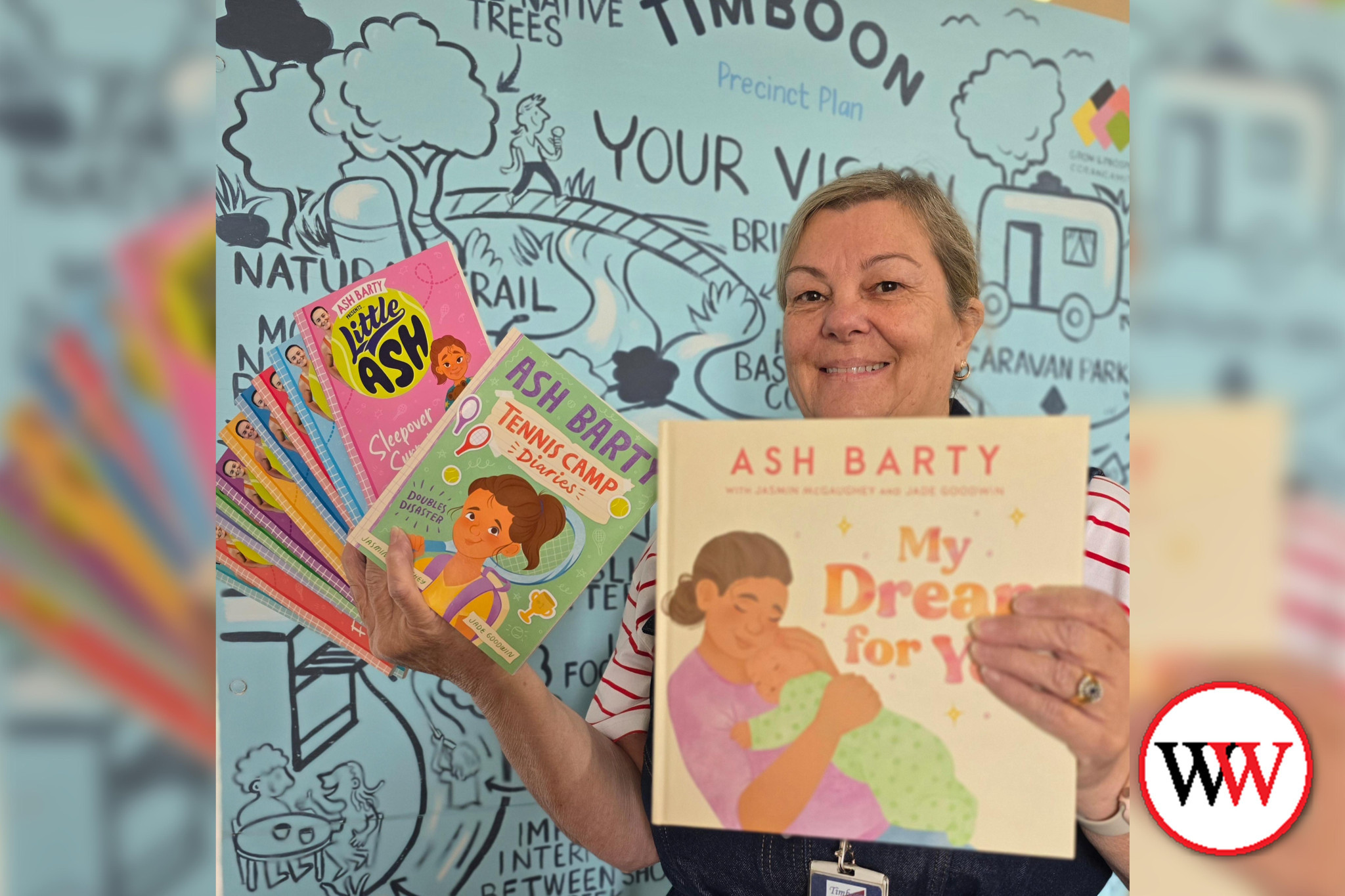 Librarian Andrea shows one of the prizes in this year’s BIG Summer Read challenge, an Ash Barty book pack.