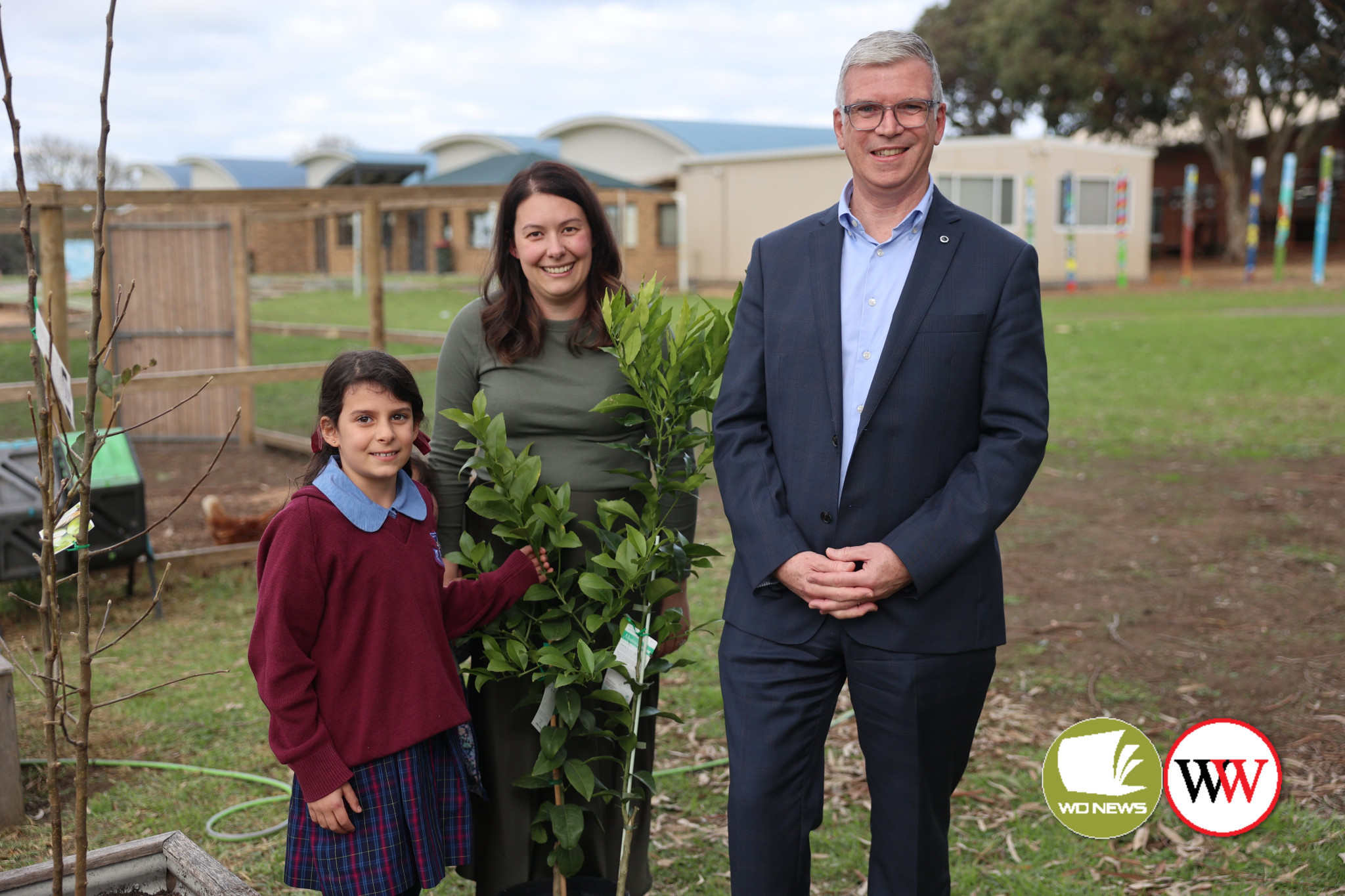 Kings College year two student Alena Topraz was the instigator behind the planting of all kinds of fruit trees on the campus grounds, which will be enjoyed by students in the coming months. Pictured with Alena is her proud mum Nadia and college principal Allister Rouse.