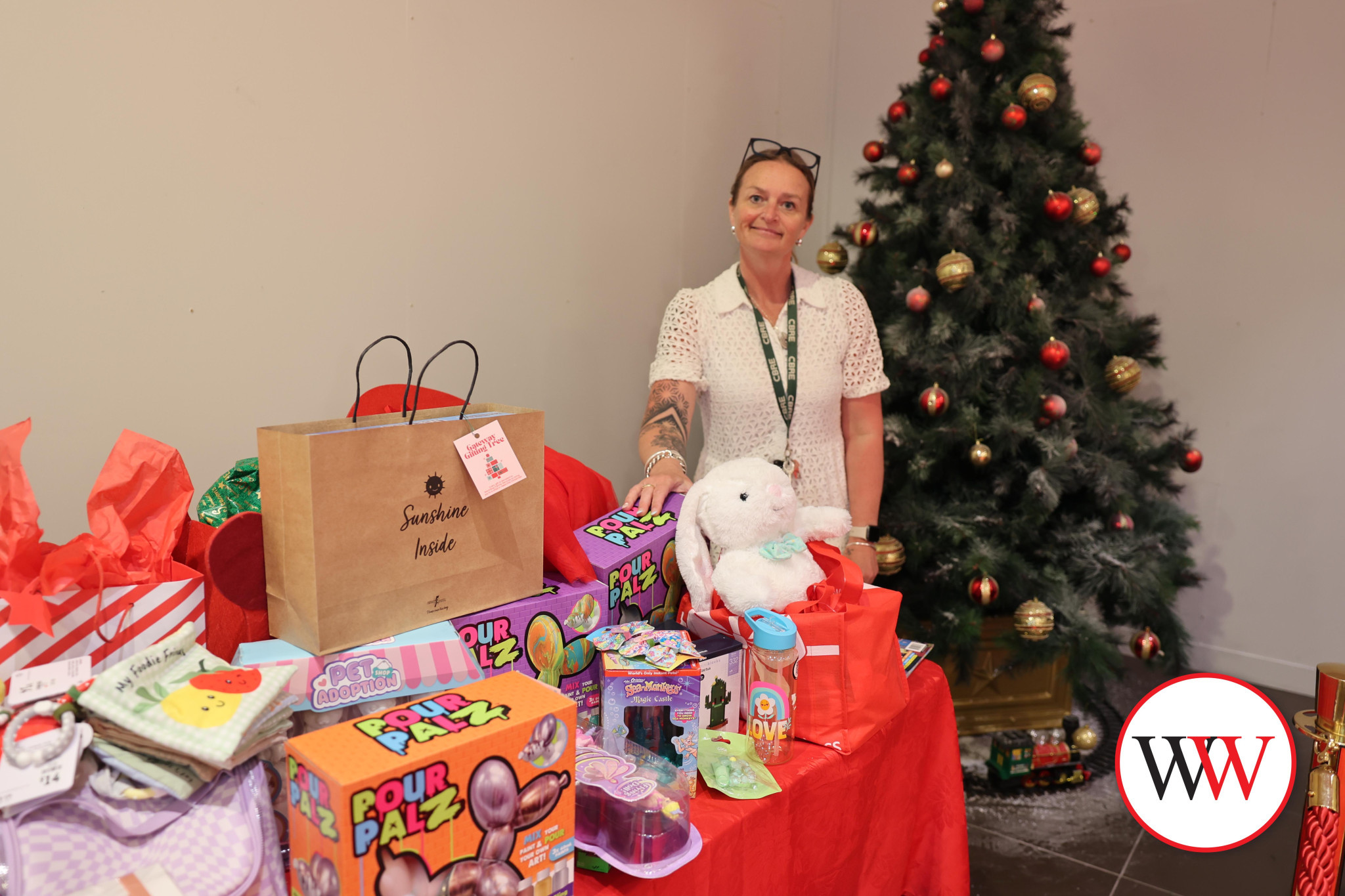 Gateway Plaza’s Sarah Porter is thrilled to see the pile of donated gifts continue to grow.