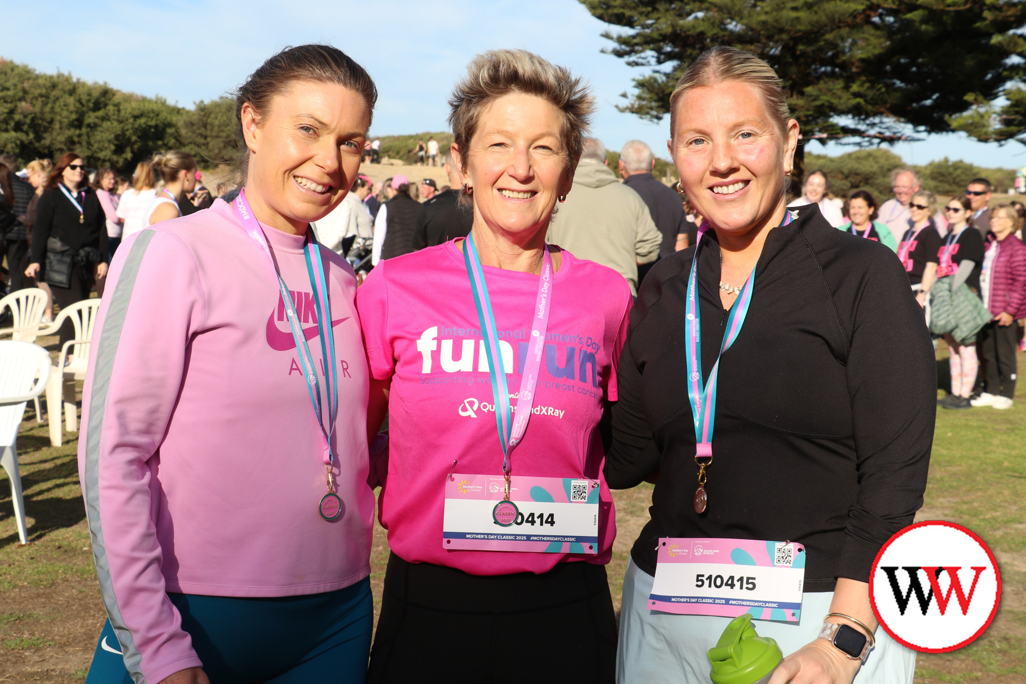 Ash Hall, Jenny Hand and Jess Kelly wear their medals with pride.