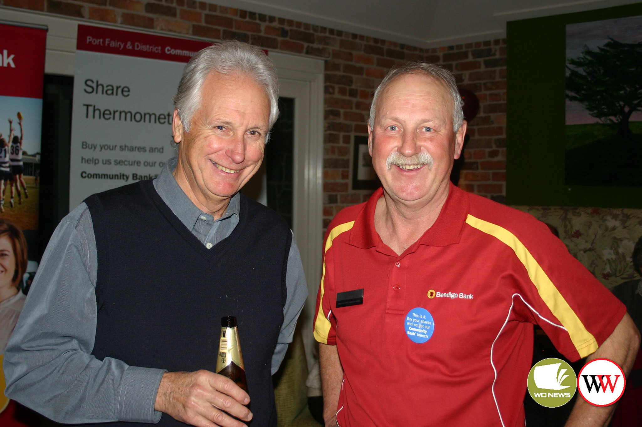 Like so many people in Port Fairy, Peter Langley (the one in red) is extremely proud of the town’s Community Bank.