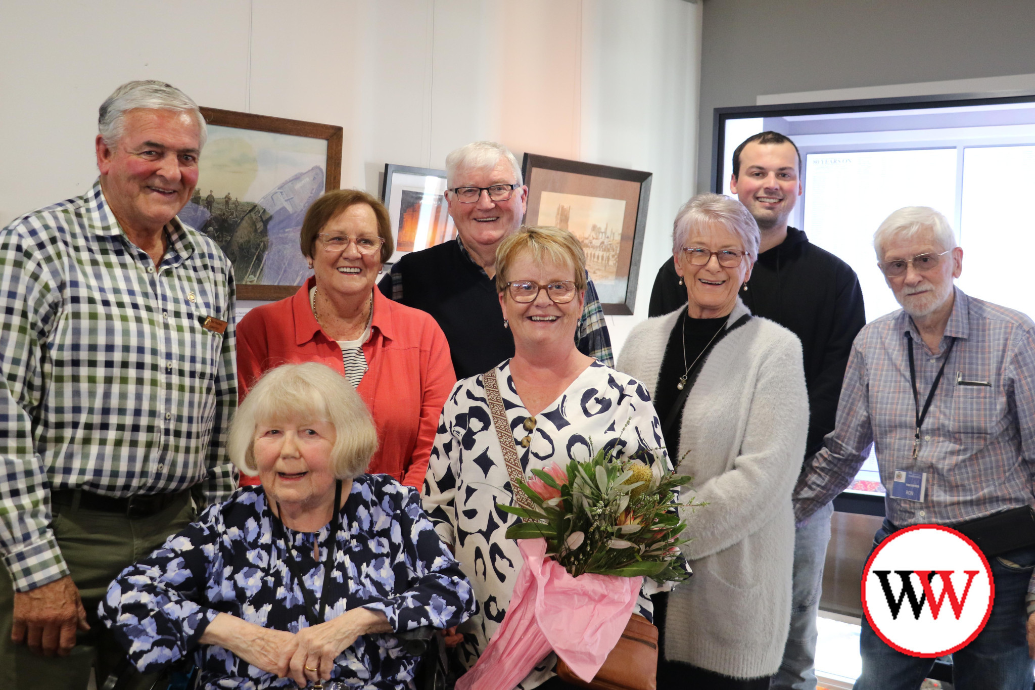 RSL volunteers celebrate the unveiling of the WW2 memorial wall.