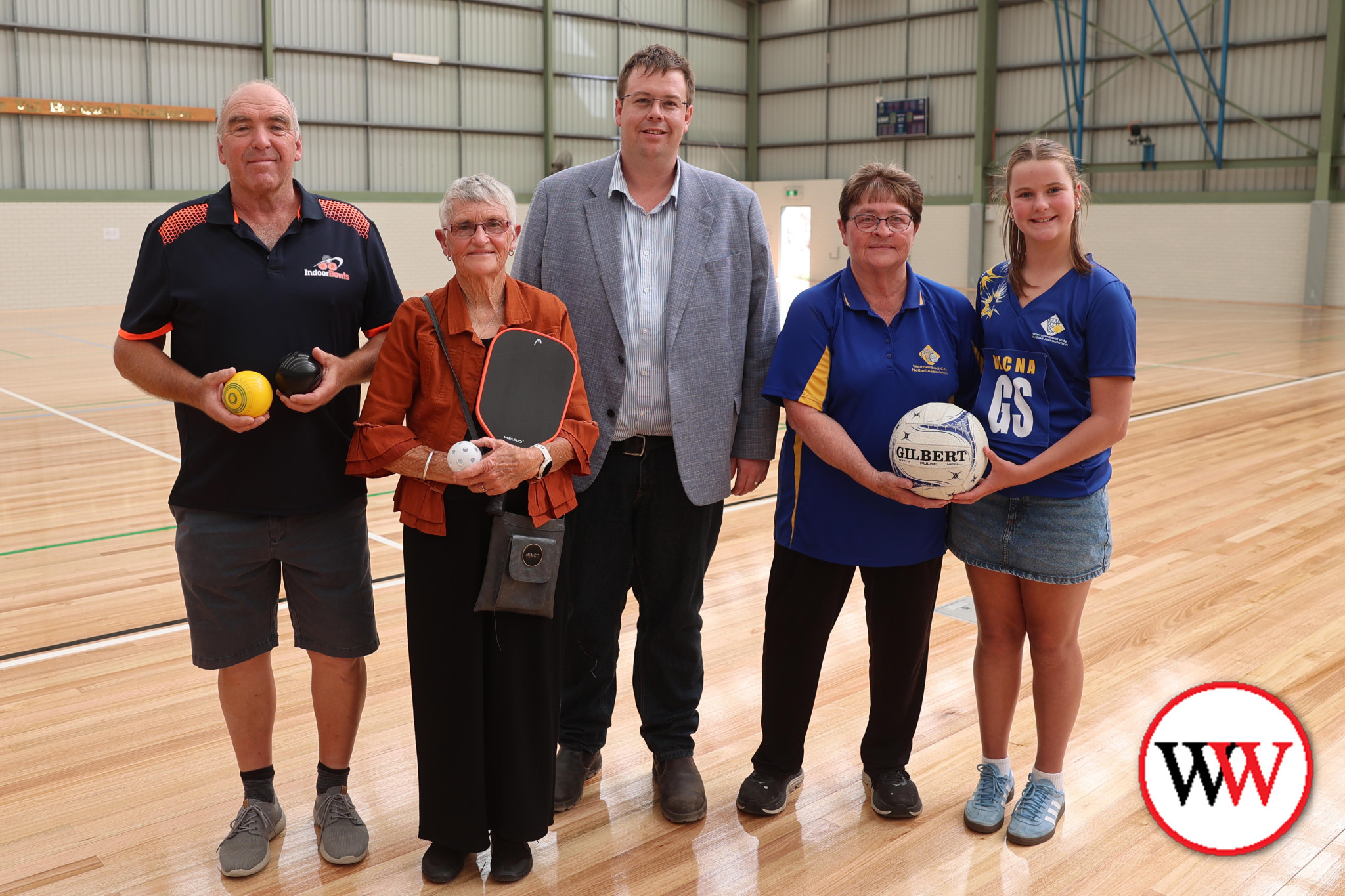 Warrnambool mayor Cr Ben Blain (centre) takes a look at the new flooring, along with (from left) George Draffen, Val Bertrand, Marg Morgan (Warrnambool City Netball) and 12 year-old netballer, Emelia Kelly.