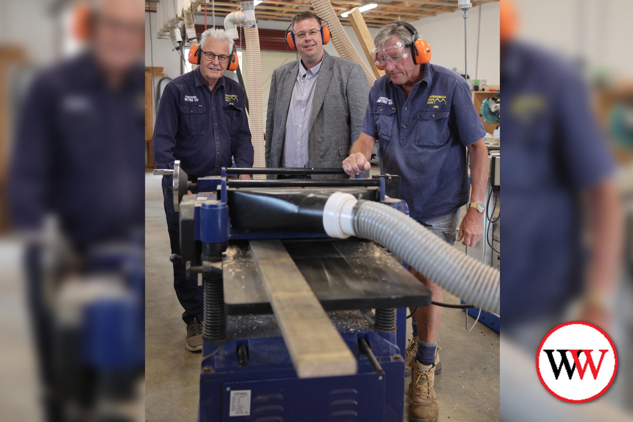 Men’s Shed members Phil Pettingill (left) and Jim Goodman show Warrnambool City mayor Cr Ben Blain the workings of some of their machinery.