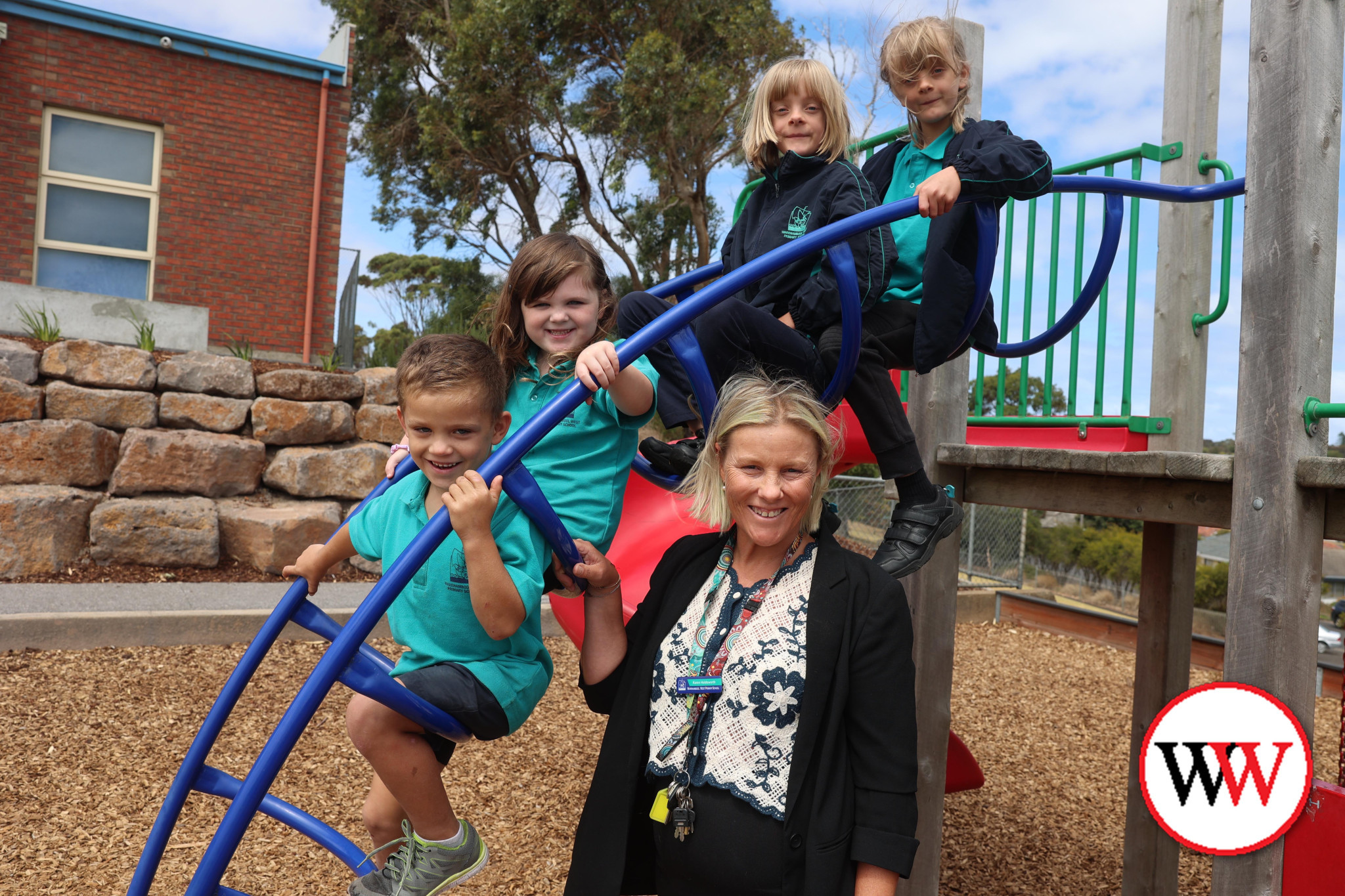 Warrnambool West principal Karen Holdsworth enjoys some time in the playground with twins Ivory and Indigo Fitzpatrick (year five) and Hank and Ava Sebire (foundation).