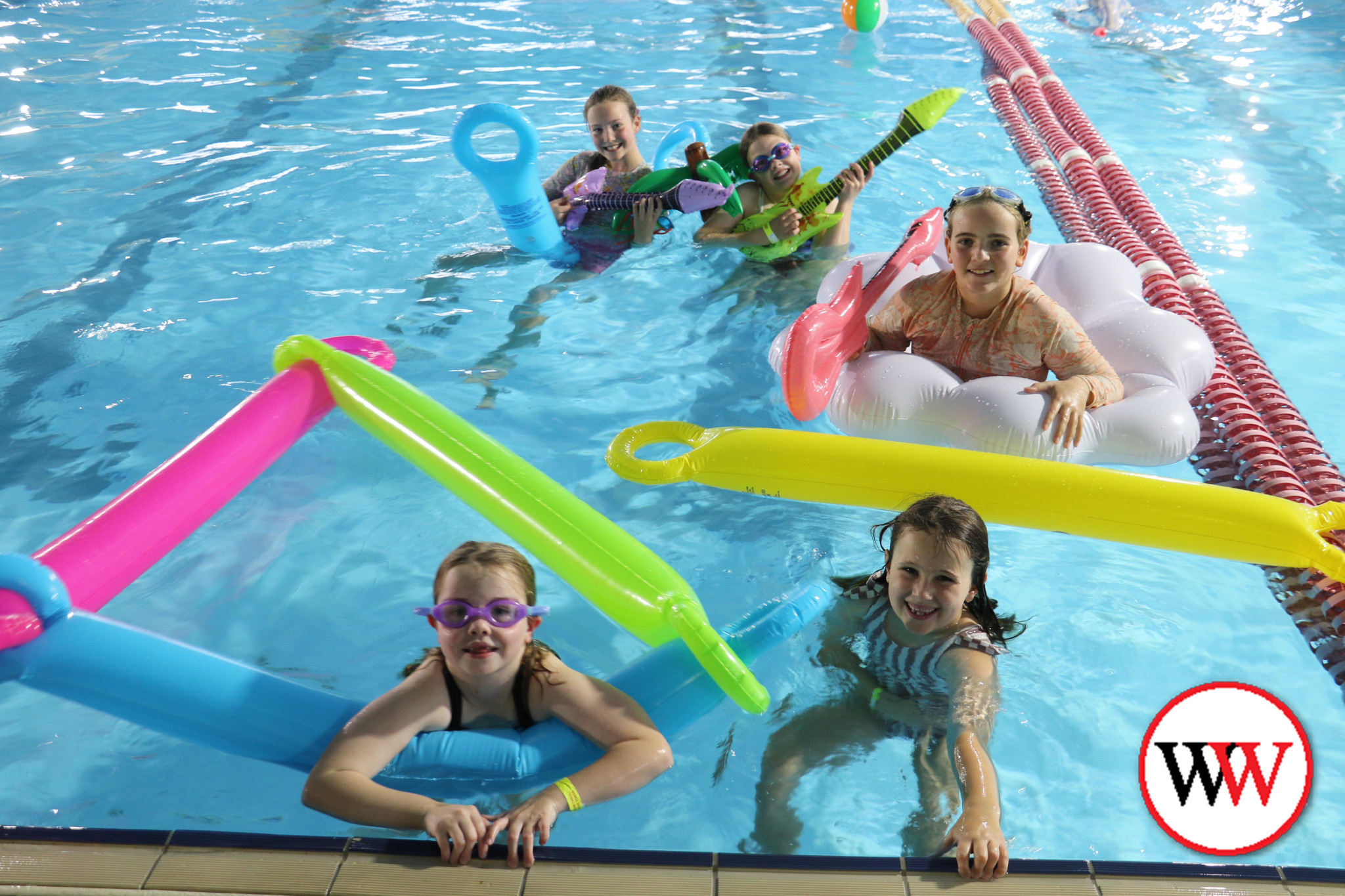 Enjoying some fun in the pool are Darcy (6) and Harper (8) along with, back row, Poppy Robinson, Inala Hayes and Marley van den Berg.