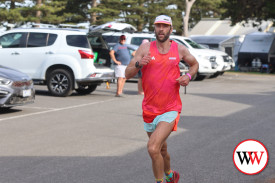 Jay Philpott crosses the halfway mark of the 12 kilometre race and went on to lead the pack home.