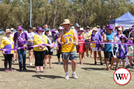 Jesse Farley, whose mum lost her battle with cancer 12 months ago, cuts the ribbon to mark the start of Warrnambool’s Relay for Life.