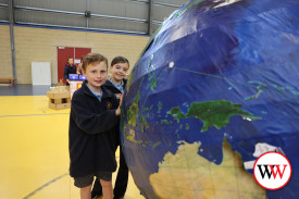 Matthew Hyatt and Hallie Wilson take a close look at the globe.