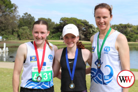 Women’s 6km run winner Charlotte Staaks (centre) with Tully Watt (second) and Alicia Boyd (third).