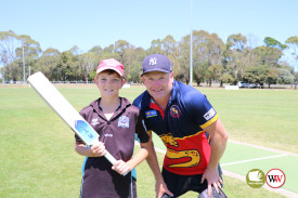 Jamie Harry presents Levi Barker from the Northern Raiders with a new bat.