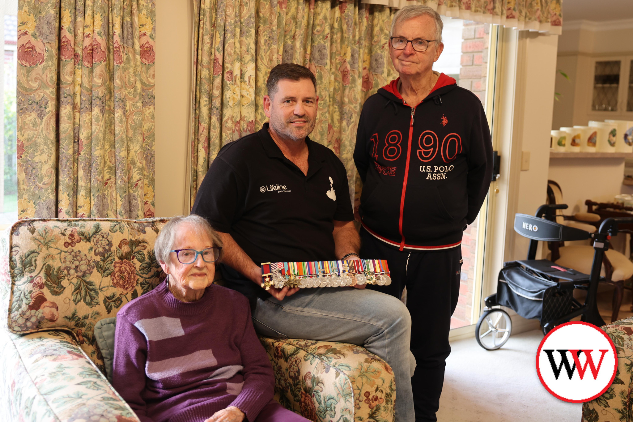 Adam Kent and military historian Doug Heazlewood with the replica medals that were recently mounted and presented to Helen Raw in honour of her late husband Peter.