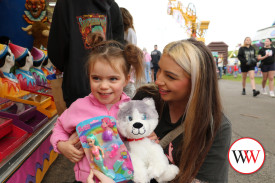 Three year-old Arrow Cooper (with Brodie Wickham) was happy with her new toys.