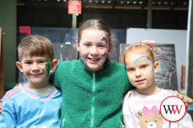 Flynn, Maisy and Addie Lumsden with bright coloured faces.