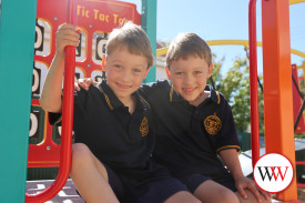 Twins Xavier and Geoffrey Walsh love the playground at Warrnambool Primary School and have already made some new friends.