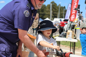 Trying to hit a target with water from the fire hose was loads of fun for youngsters.