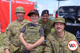 Nine year-old Paddy Gordon from Portland was excited to meet defence force personnel Charlie, Kym and Zac at the show and try on some camouflage gear.