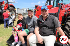 Isaac Fowler from TTMI (right) was happy to sit and chat ‘all things tractors’ with Michael Rhode and 11 year-old Koa Fary of Warrnambool.