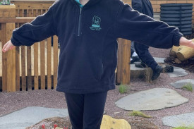 Charlotte Cowley tests her balance on the log.