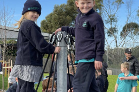 Scarlett Downes and Jaxon Parsons try the climbing frame.