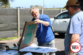 Pete demonstrating shirt printing.