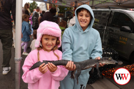 Nine year-old August Taulaga and sister Ally, from Warrnambool, were eager to hold a baby crocodile when they visited Wunta.